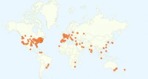 A pale world map scattered with orange dots marking visitor locations, concentrated in North America, Europe and Asia.